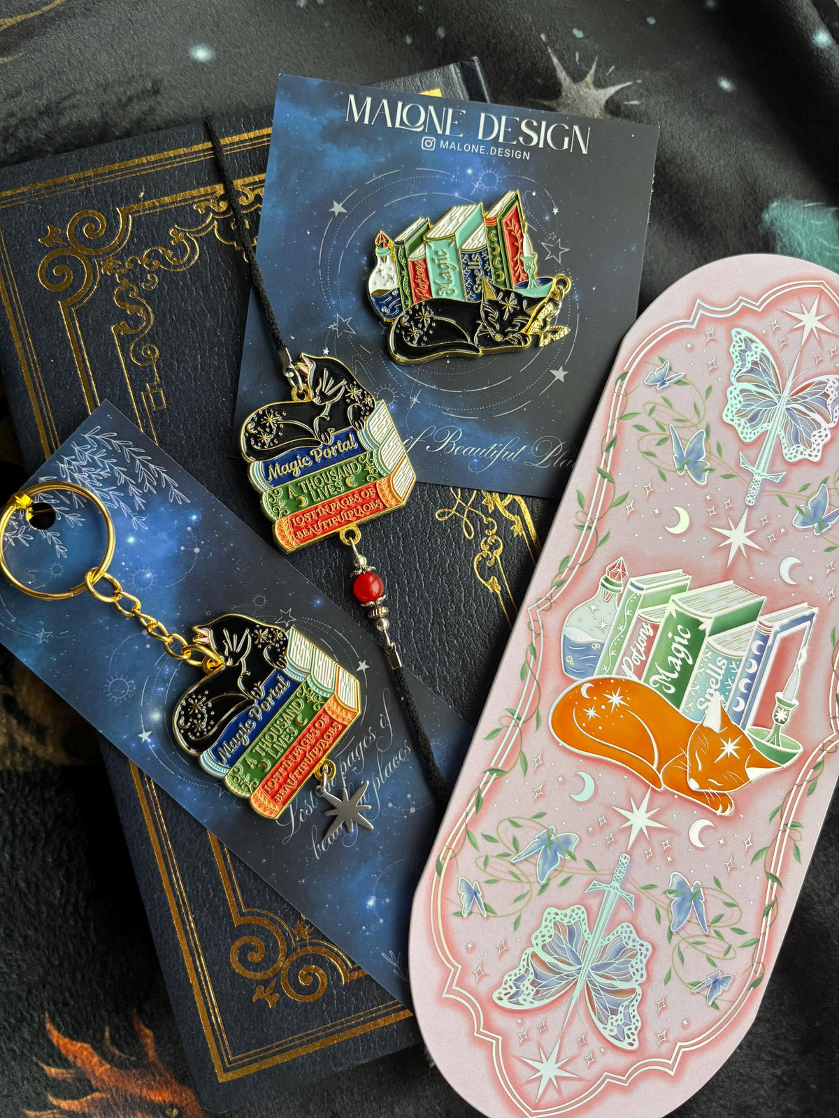 Cat Bookstack Magic Collection Bookmark. Pink holographic foiled bookmark with ginger cat.