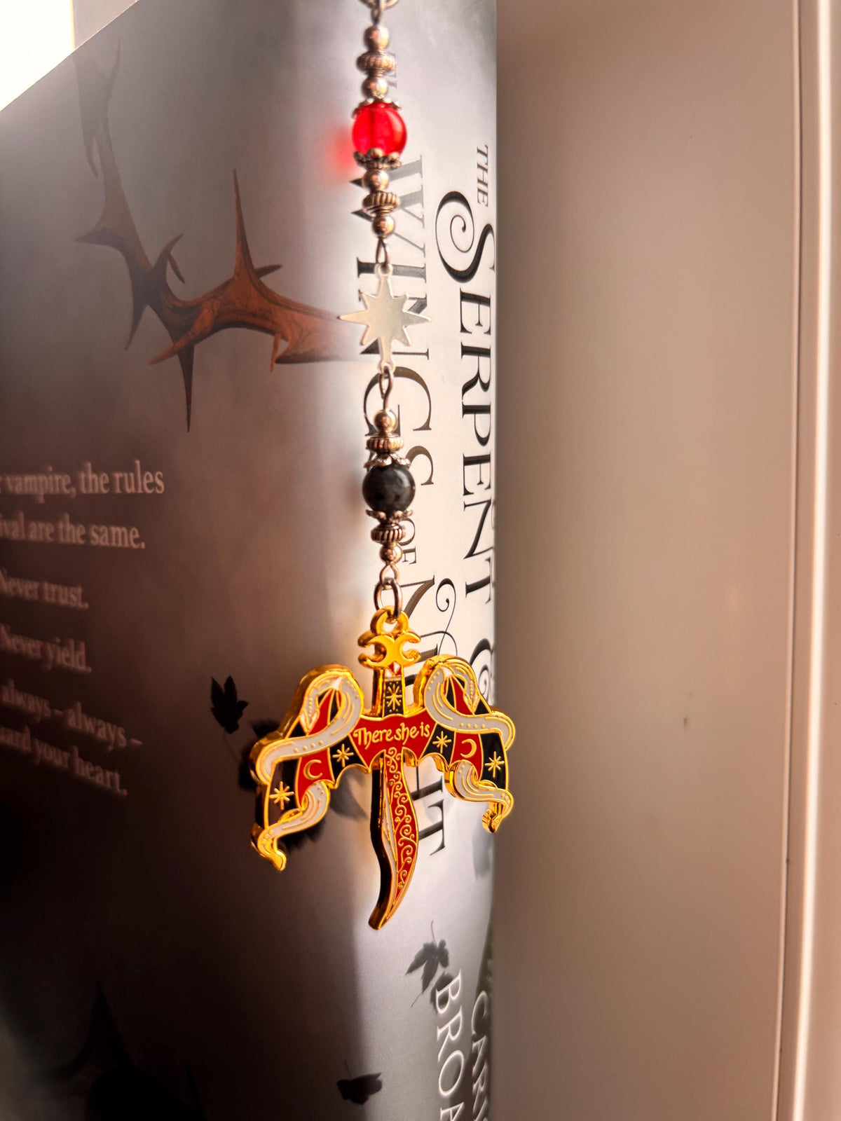 Crowns of Nyaxia Bookmark or Keychain. There she is - officially licensed Merch by Carissa Broadbent