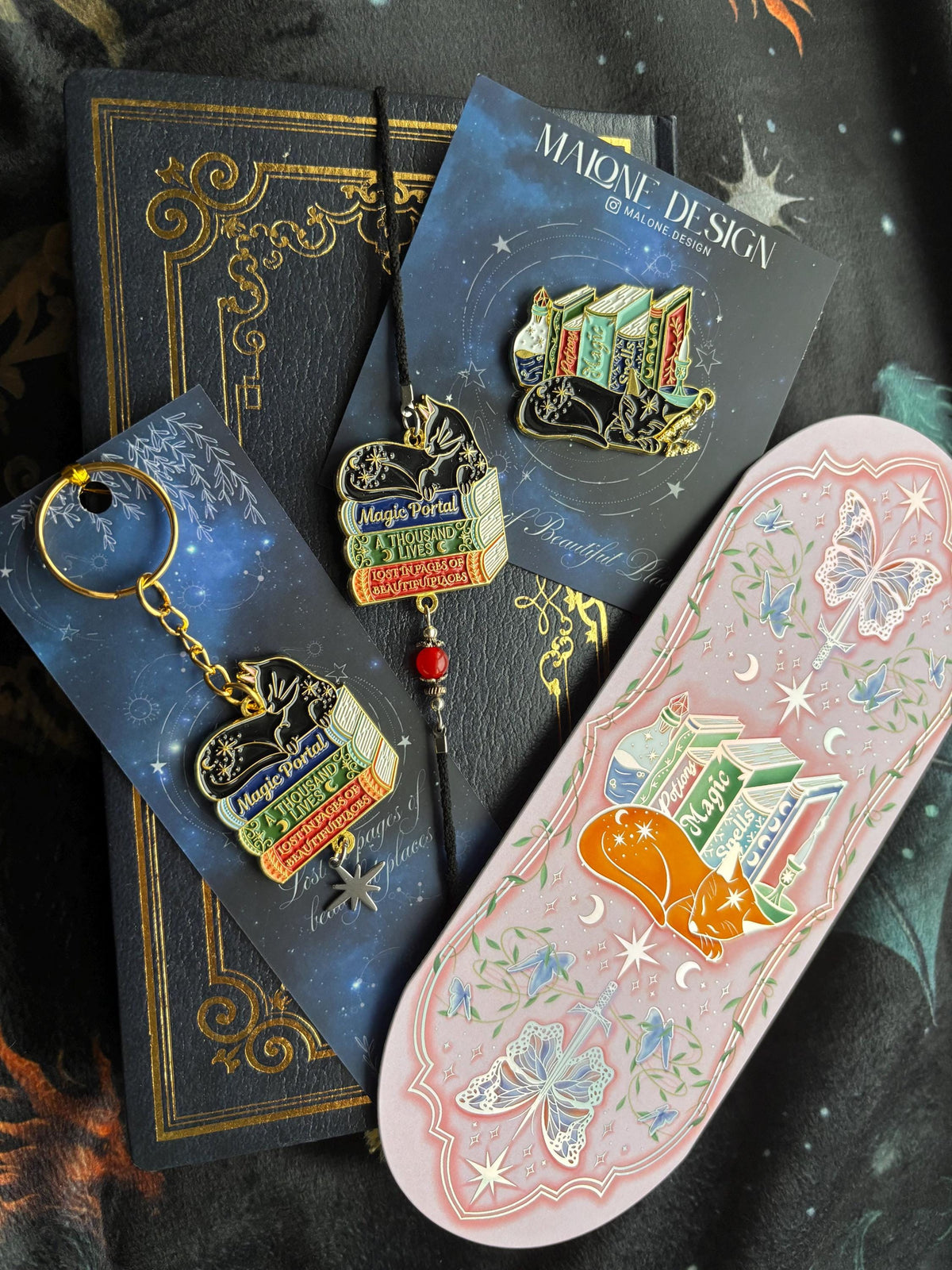 Cat Bookstack Magic Collection Bookmark. Pink holographic foiled bookmark with ginger cat.