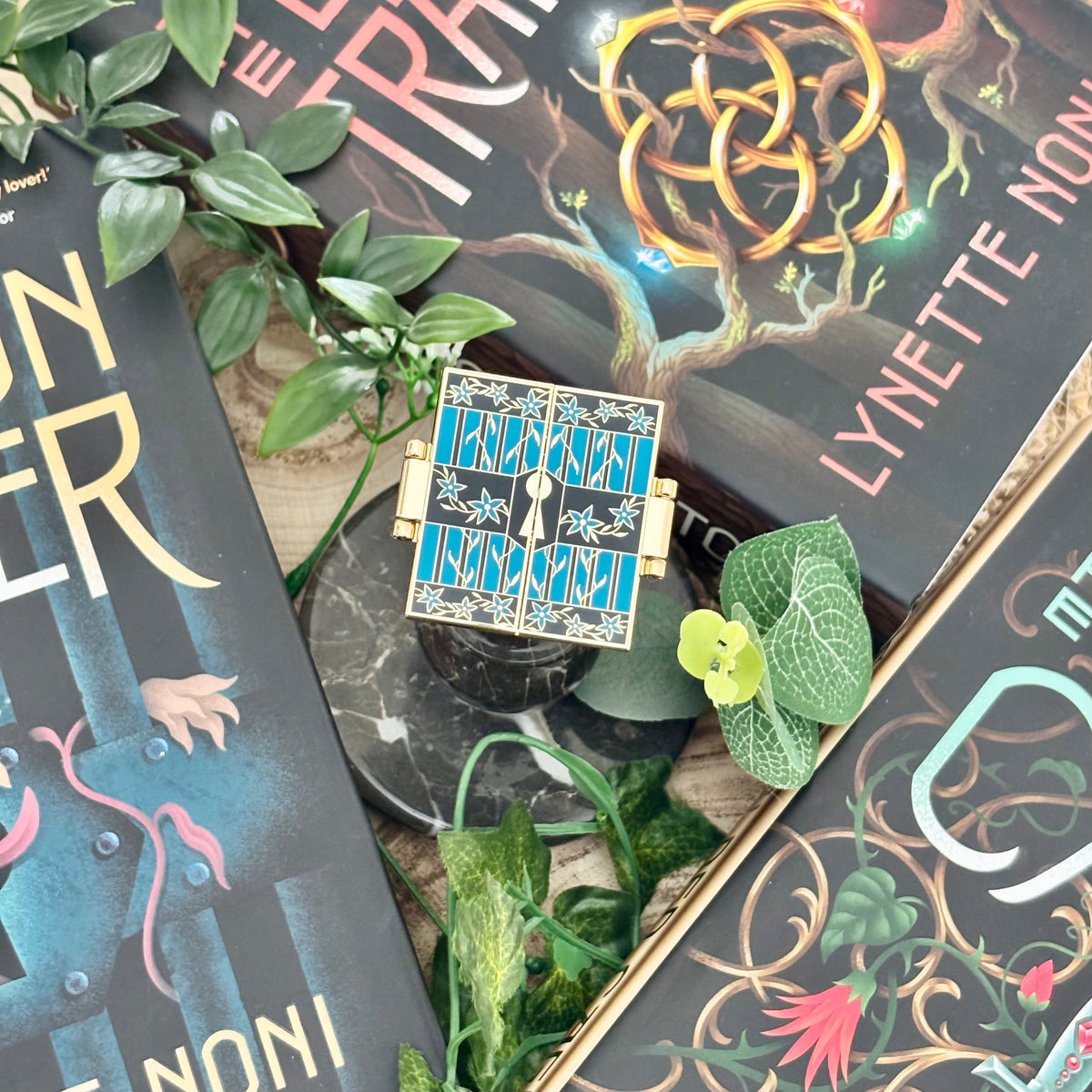 The Prison Healer Officially Licensed Pin Badge - Lynette Noni. Interactive pin badge in hard enamel.