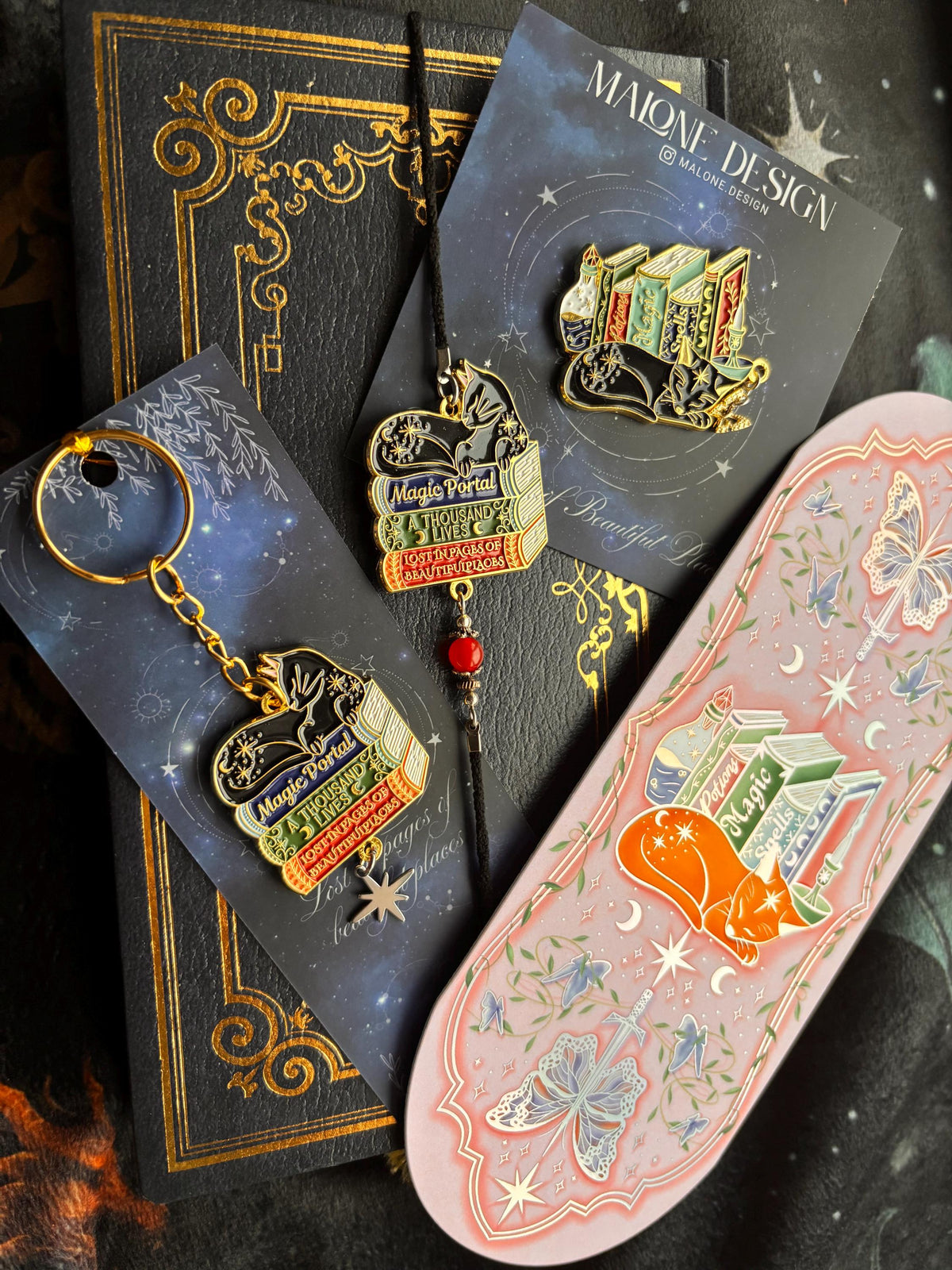 Cat Bookstack Magic Collection Bookmark. Pink holographic foiled bookmark with ginger cat.