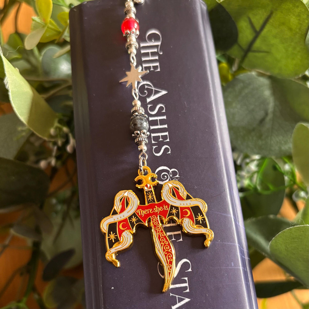 Crowns of Nyaxia Bookmark or Keychain. There she is - officially licensed Merch by Carissa Broadbent