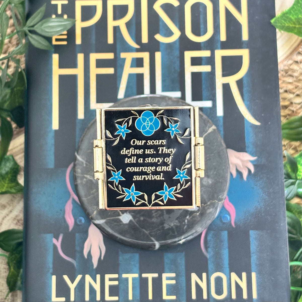 The Prison Healer Officially Licensed Pin Badge - Lynette Noni. Interactive pin badge in hard enamel.