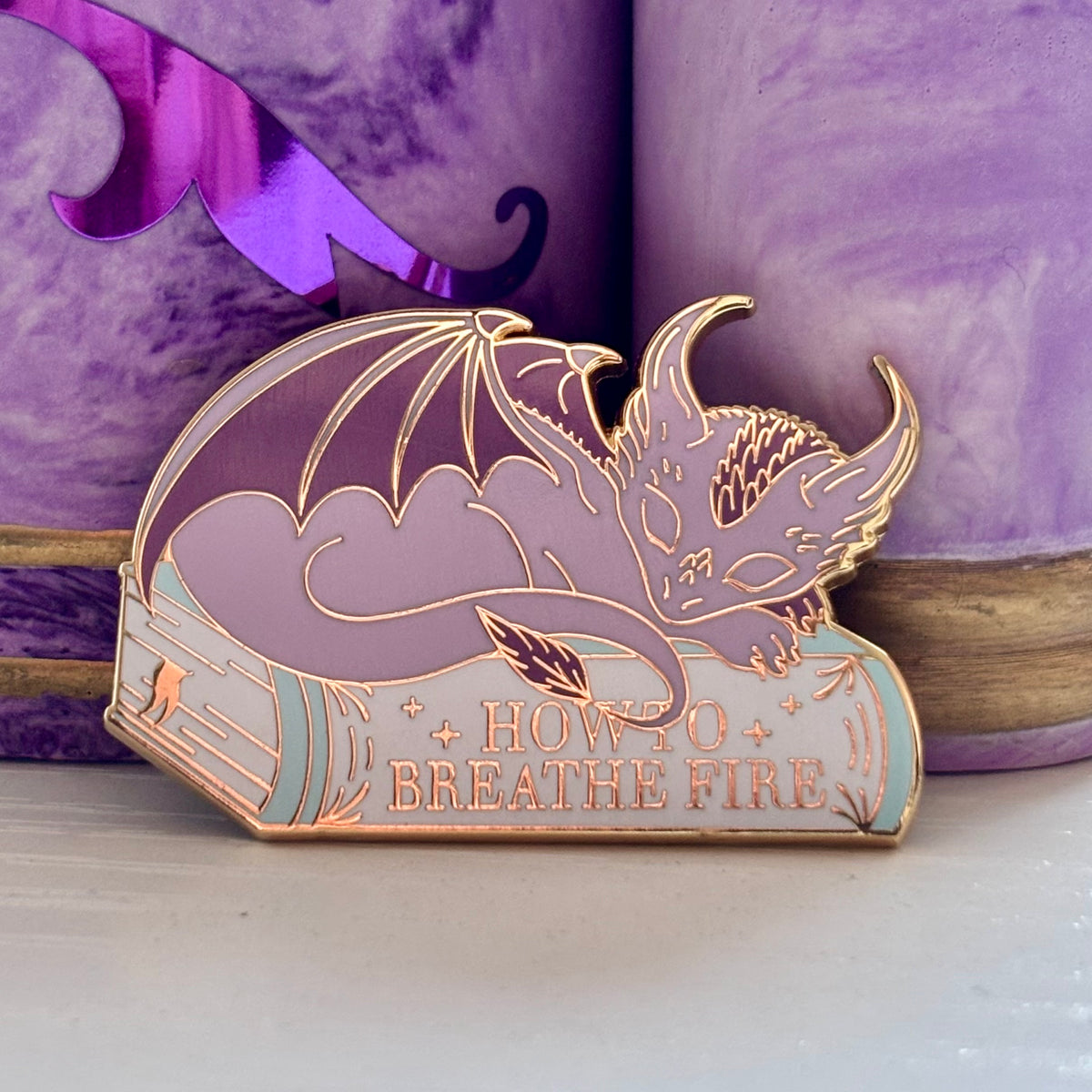 Baby Sleeping Dragon Bookstack Pin Badge. How to breathe fire.