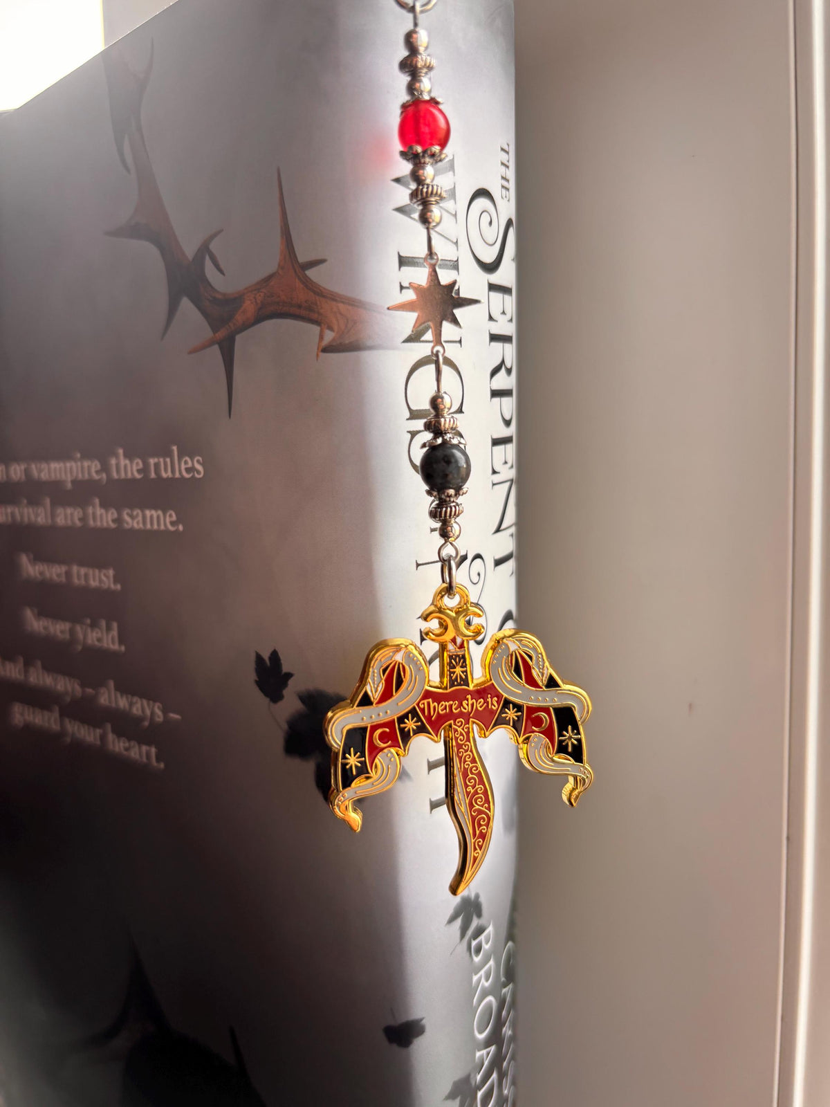 Crowns of Nyaxia Bookmark or Keychain. There she is - officially licensed Merch by Carissa Broadbent