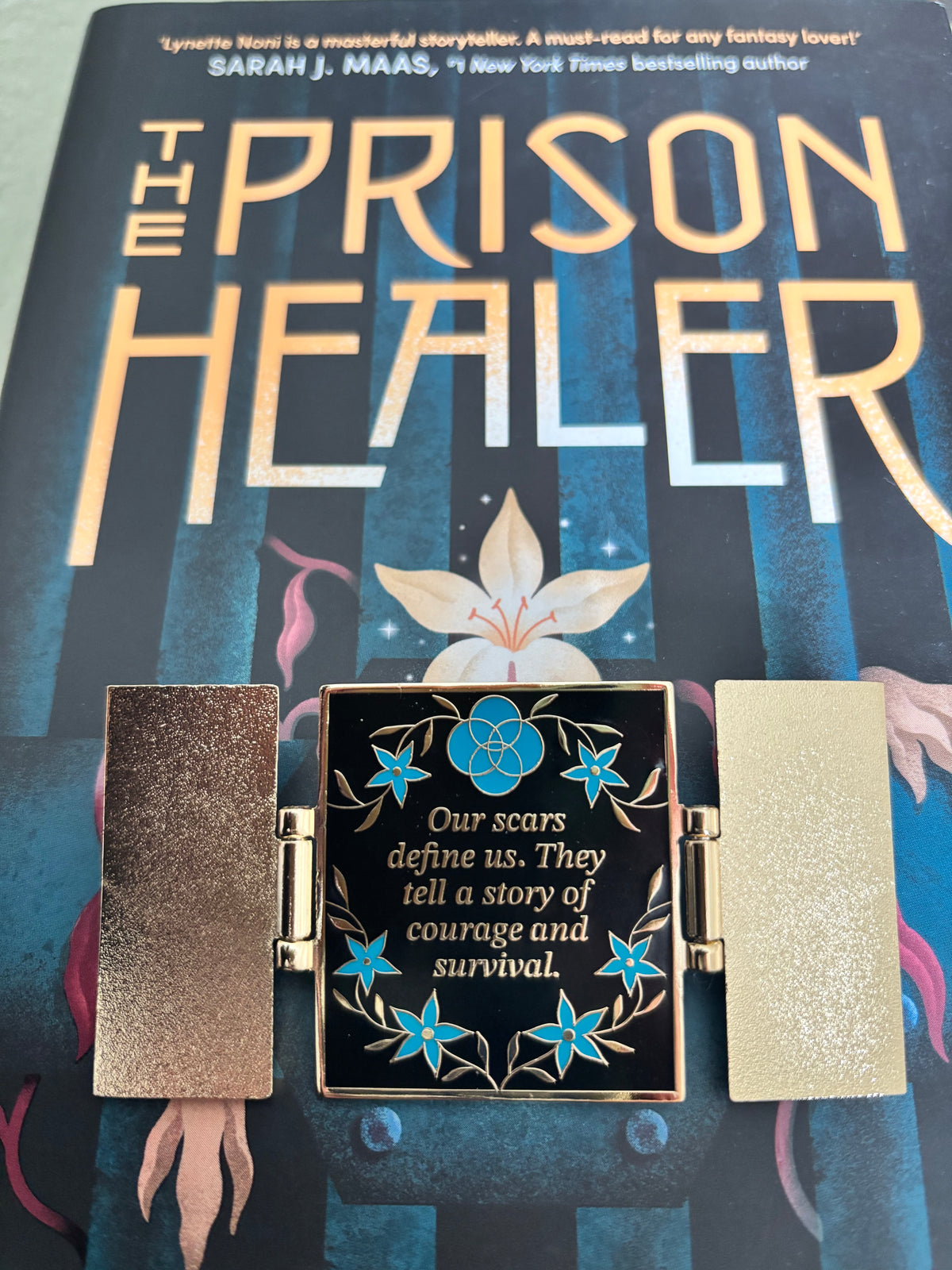 The Prison Healer Officially Licensed Pin Badge - Lynette Noni. Interactive pin badge in hard enamel.