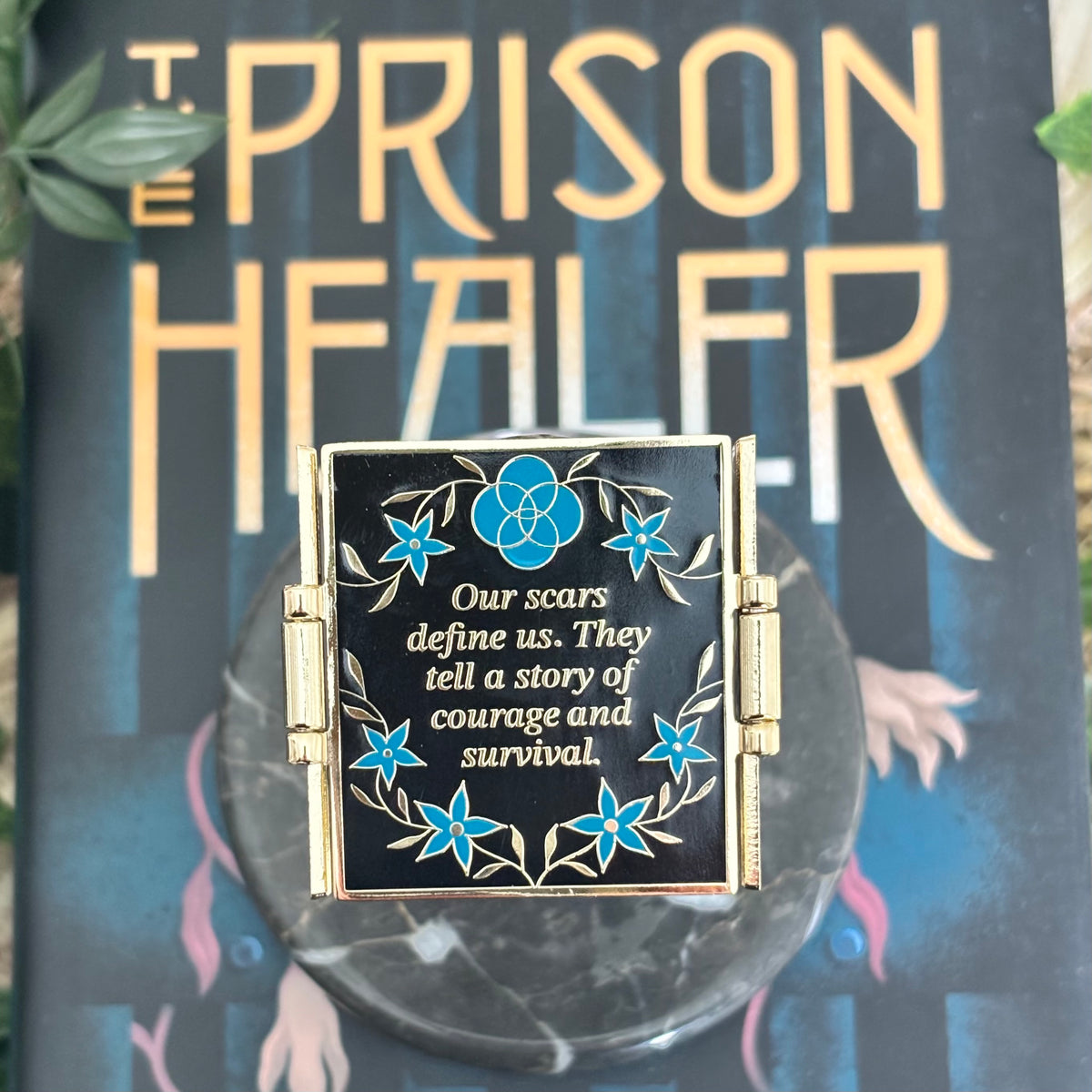 The Prison Healer Officially Licensed Pin Badge - Lynette Noni. Interactive pin badge in hard enamel.