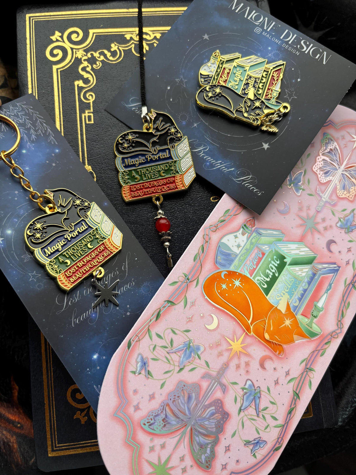 Cat Bookstack Magic Collection Bookmark. Pink holographic foiled bookmark with ginger cat.