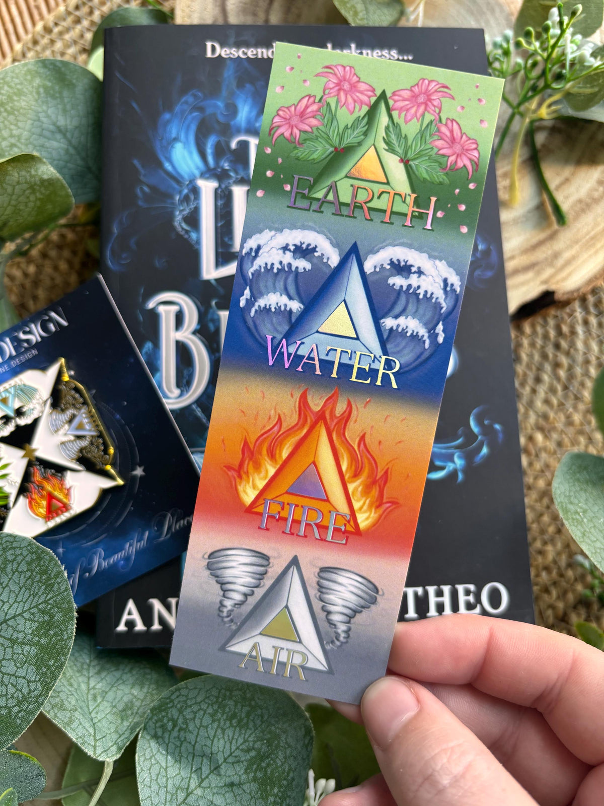 Elemental Foil bookmark and Pin Badge. Earth, Water, fire and Air. Andy Darcy Theo. The Light That Blinds Us Official Merch.