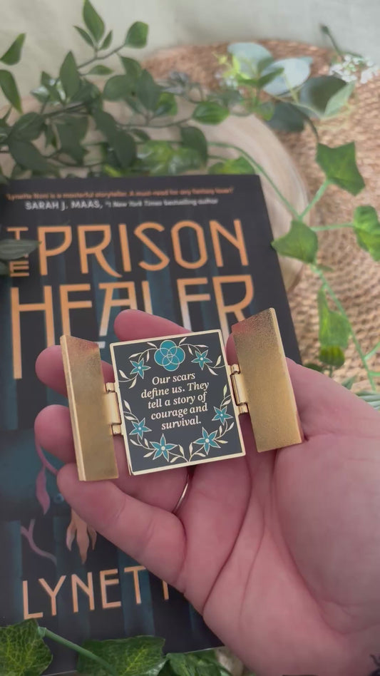 The Prison Healer Officially Licensed Pin Badge - Lynette Noni. Interactive pin badge in hard enamel.